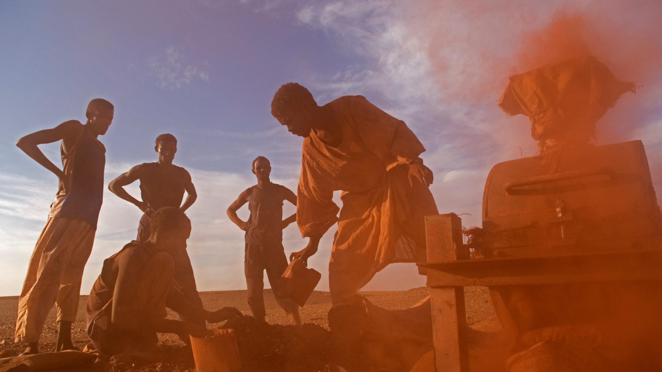 Pieces of rocks are put to a special machine which is crushing it into dust in Sudan.