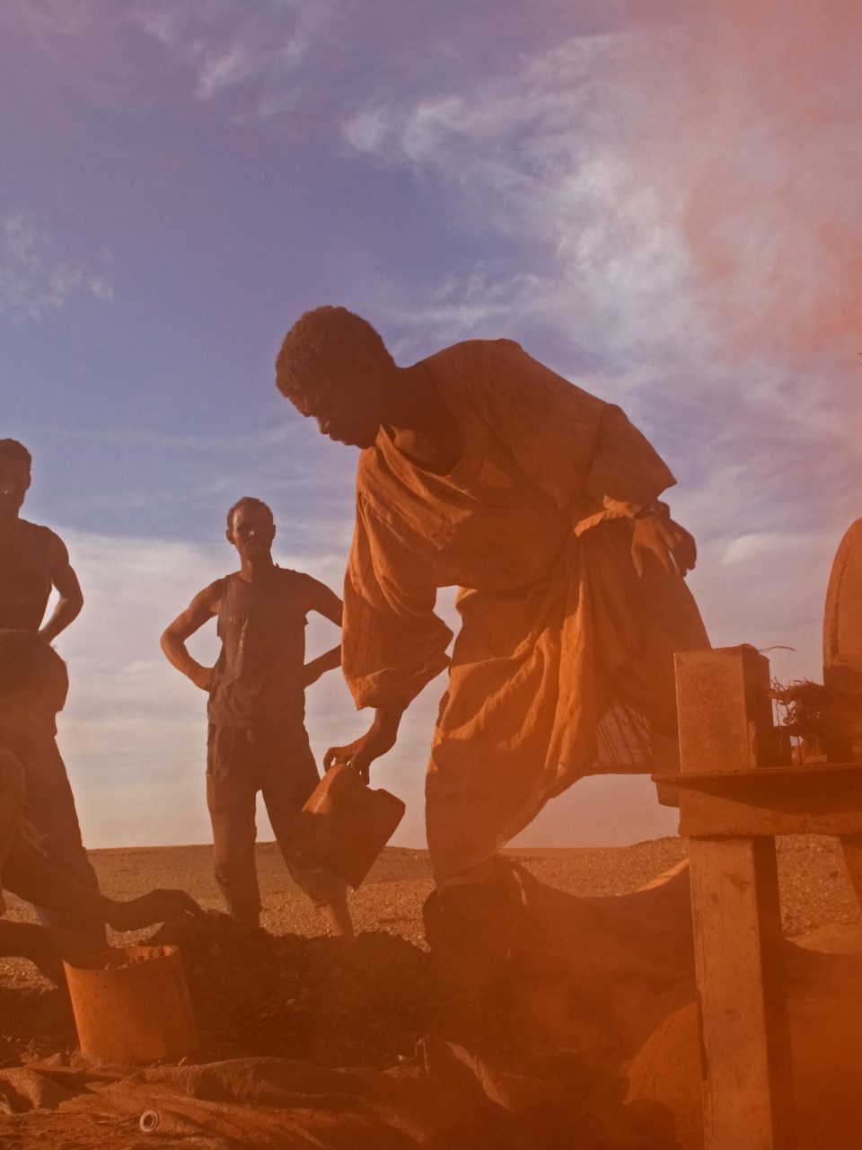 Pieces of rocks are put to a special machine which is crushing it into dust in Sudan.